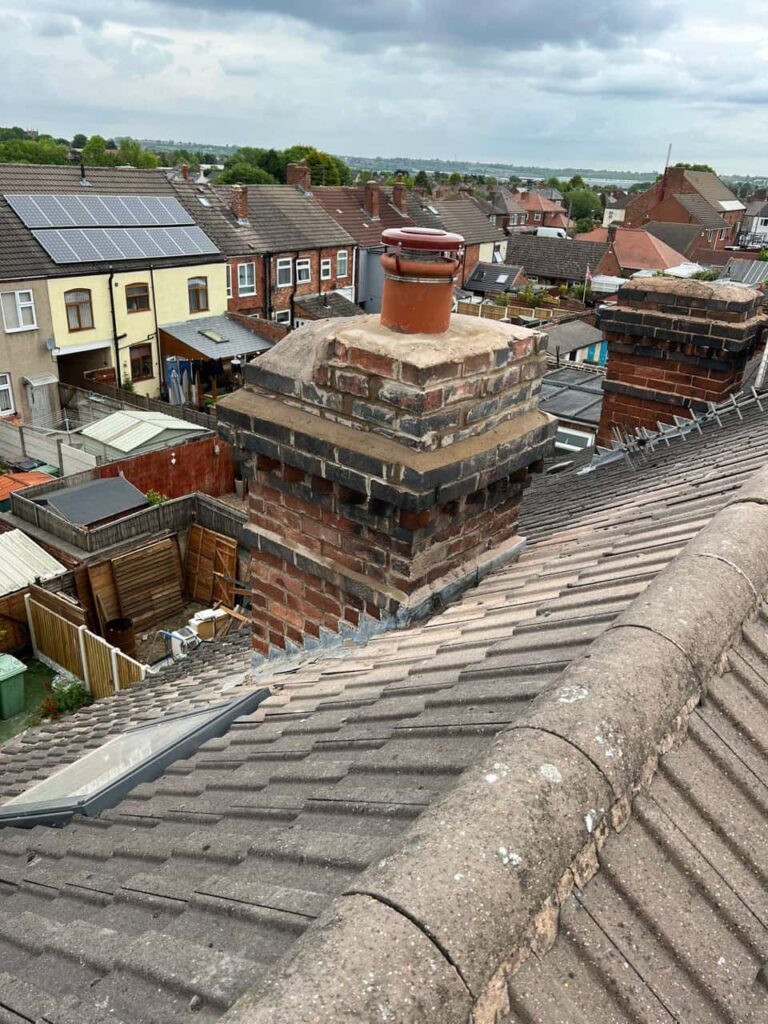 This is a photo taken from a roof which is being repaired by Borrowash Roofing Repairs, it shows a street of houses, and their roofs